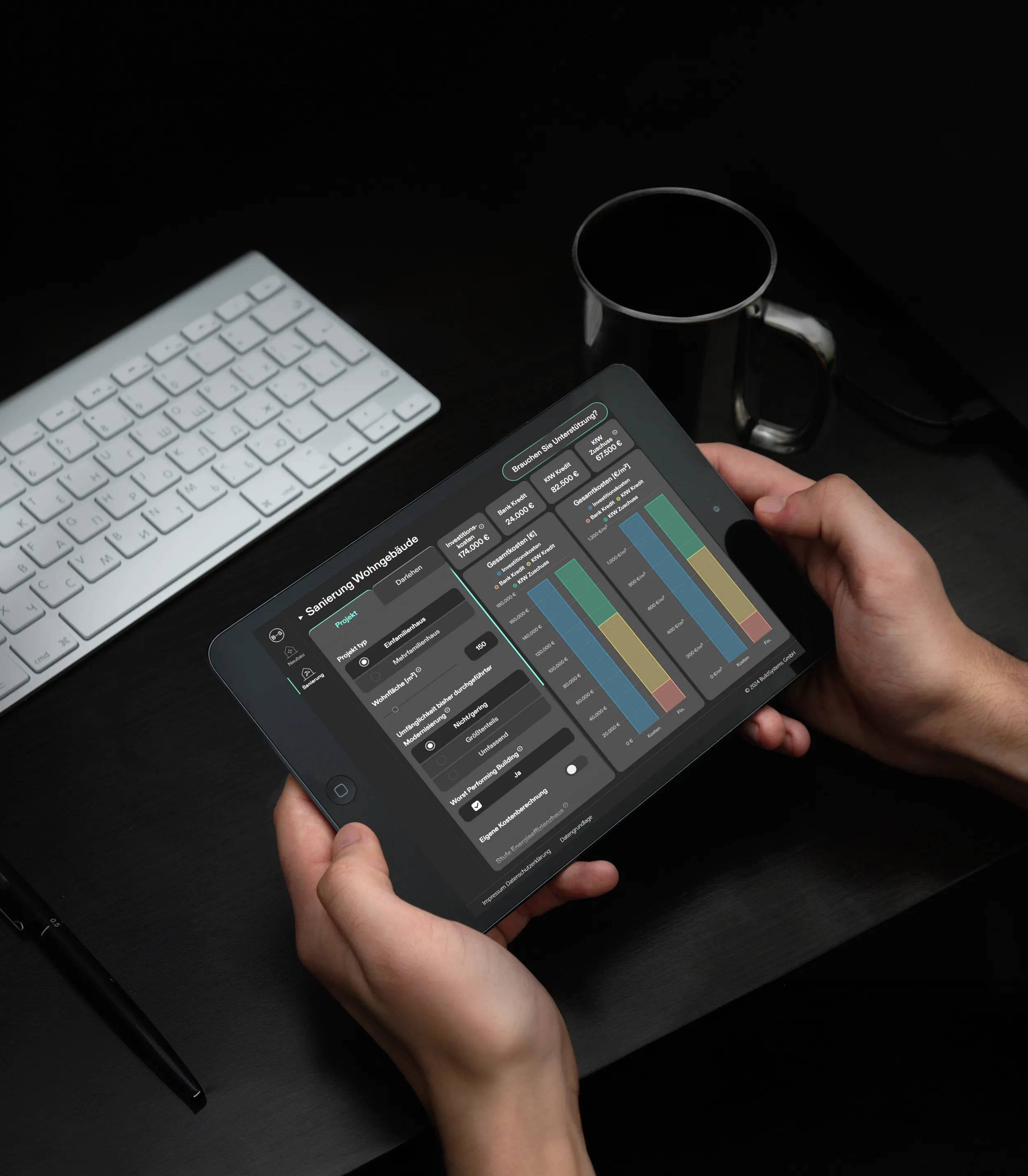 User holding a tabled with the BuildSystems app open on the Sanierung tool.